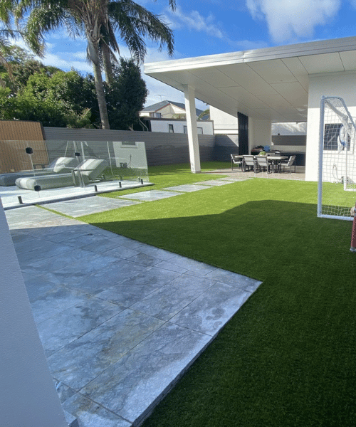 Modern backyard with patio and lawn area.