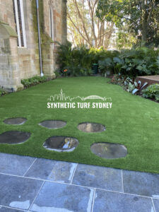 Synthetic turf installed in a Sydney backyard with stepping stones.